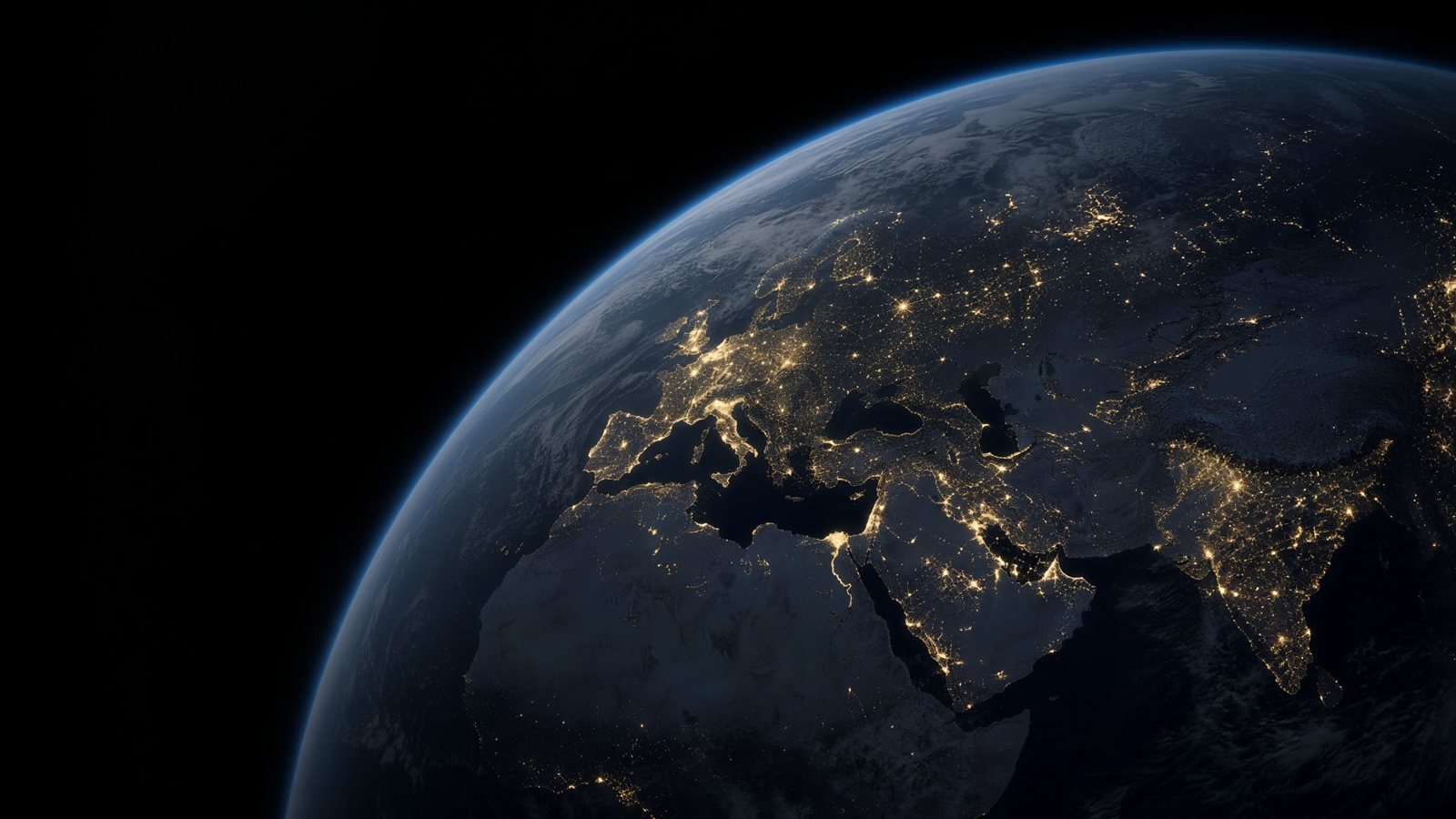 La Terra di notte, con le luci delle città su Europa, Africa e Asia
