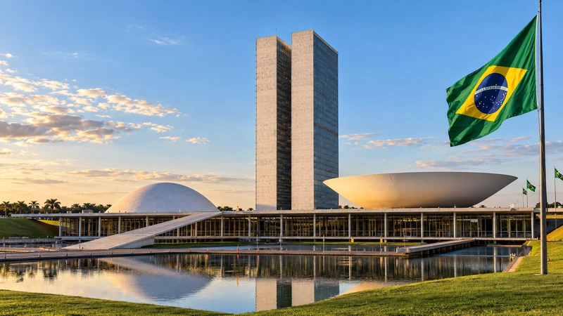 Illustrazione editoriale IA del Congresso nazionale a Brasilia, con le torri e le cupole di Oscar Niemeyer; non documenta la seduta.