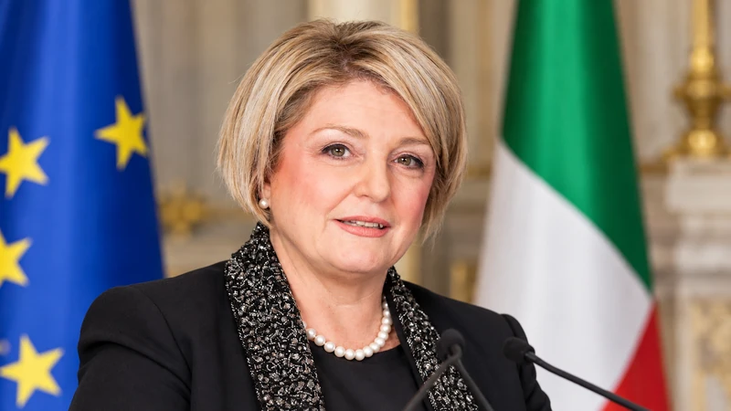 Illustrazione editoriale IA con somiglianza sintetica di Marina Elvira Calderone in contesto istituzionale; non è la fotografia della conferenza del 13 ottobre.