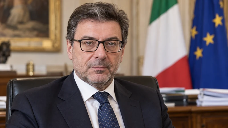 Somiglianza sintetica editoriale IA di Giancarlo Giorgetti in un contesto istituzionale; non è una foto del negoziato sulla manovra.